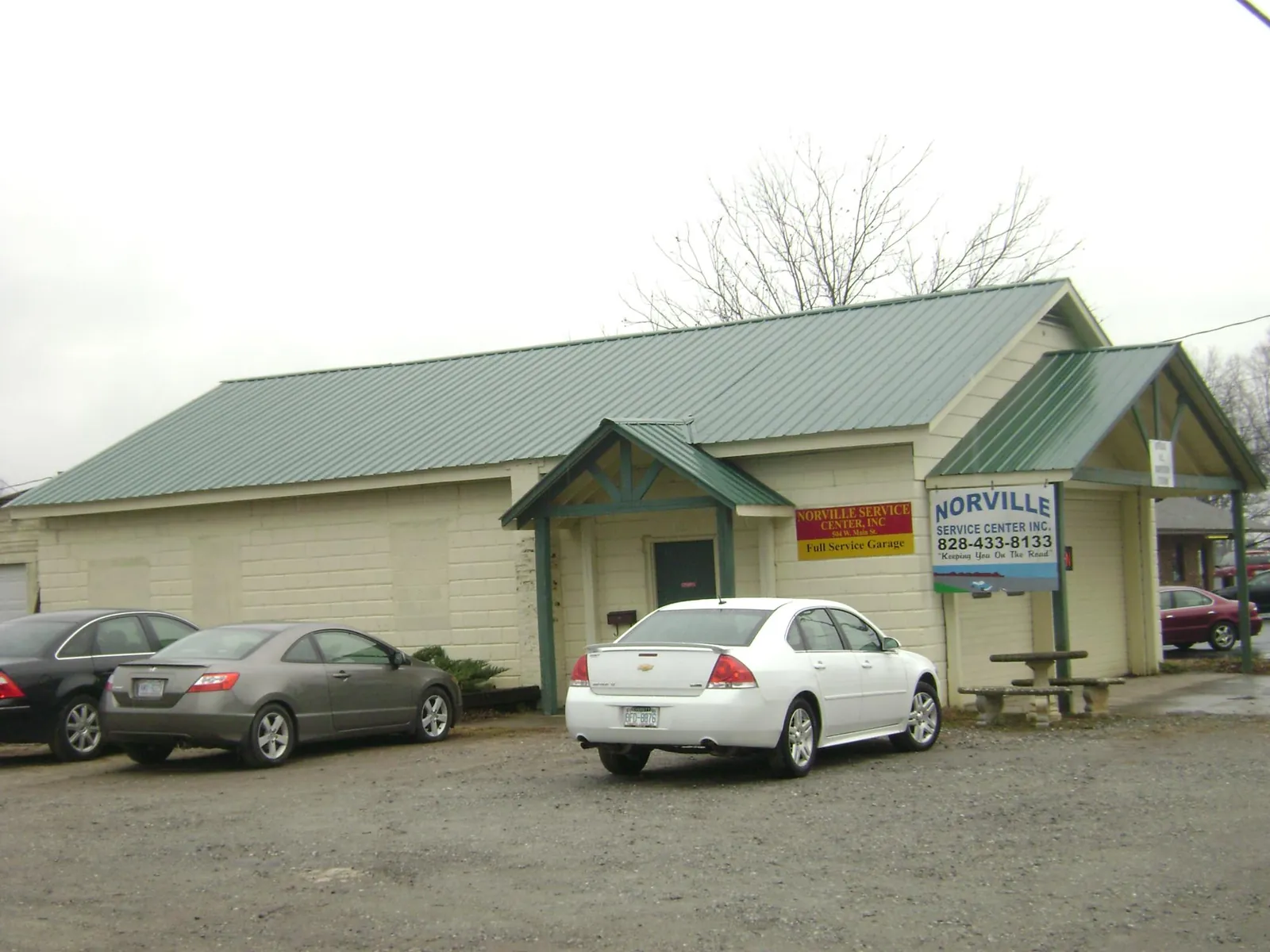 Green metal roof on a service garage with a covered entry in Newfoundland